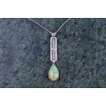 A diamond and opal drop pendant necklace in the Art Deco style, set with a pear-shaped cabochon opal