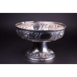 A 19th century German silver centerpiece/fruit bowl, with repoussé foliate decoration on a