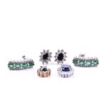 A pair of 9ct white gold and emerald earrings, 1.7 cm long, together with a pair of diamond and