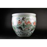 A Chinese porcelain fishbowl, 19th/20th century, painted with a watery landscape with blossoming