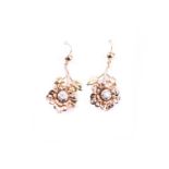 A pair of antique yellow gold and diamond floral earrings, each earring inset with an old-cut