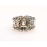 A 1940s yellow gold and diamond ring, the bow-style mount pave-set with diamond acccents, set in a