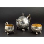 A Victorian silver Aesthetic style three piece tea set Birmingham 1900, by Elkington and Co.,