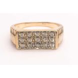 A 9ct yellow gold and CZ gents ring, the oblong mount inset with fifteen round CZs, grain-set,