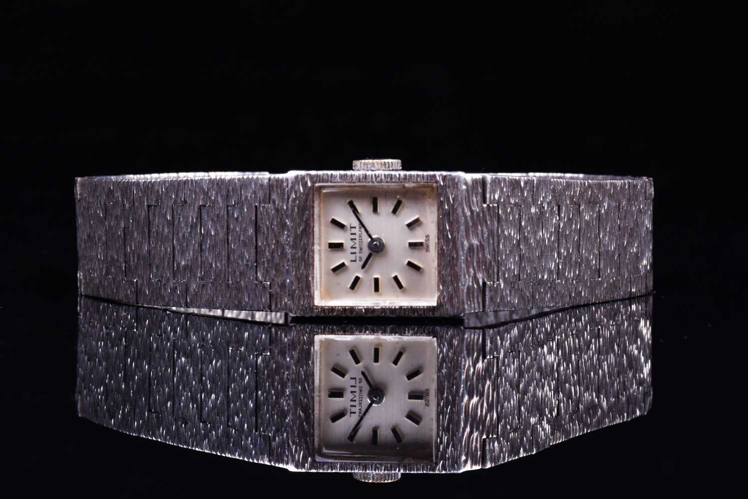 A Limit of Switzerland ladies silver wristwatch, the square dial with baton markers, on a textured