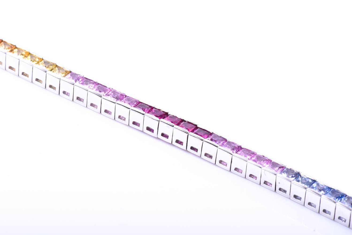 An 18ct white gold and rainbow sapphire bracelet, set with multi-coloured sapphires ranging from - Image 6 of 9