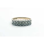 A 9ct yellow gold and diamond ring, grain-set with twenty diamonds of approximately 0.20 carats