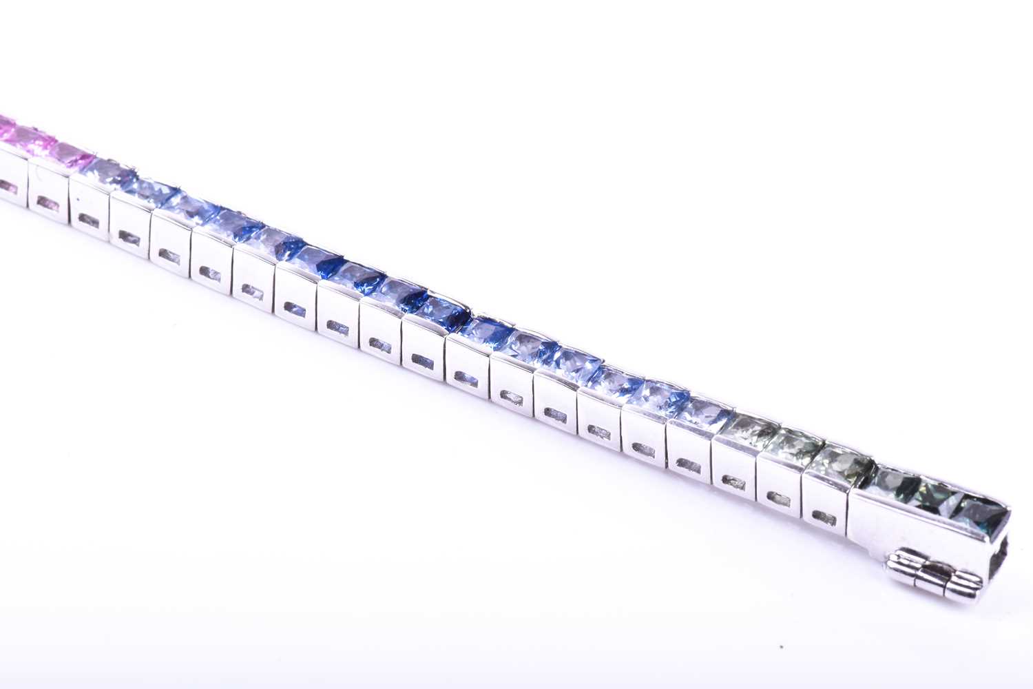 An 18ct white gold and rainbow sapphire bracelet, set with multi-coloured sapphires ranging from - Image 3 of 9