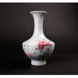 A Chinese famille rose vase, late Qing, 19th century, the flaring rim above the neck with raised