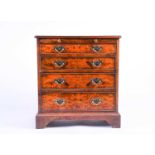 A Georgian style small chest, oyster veneer, with slide over four graduated drawers on bracket feet,