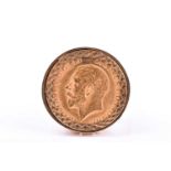 A 9ct yellow gold half sovereign ring, in bright-cut mount, depicting George V (date indistinct