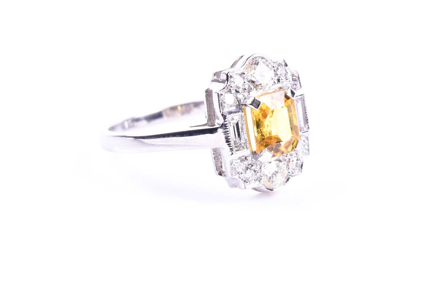 A platinum, diamond, and yellow sapphire ring, in the Art Deco style, set with a mixed-cut - Image 2 of 5