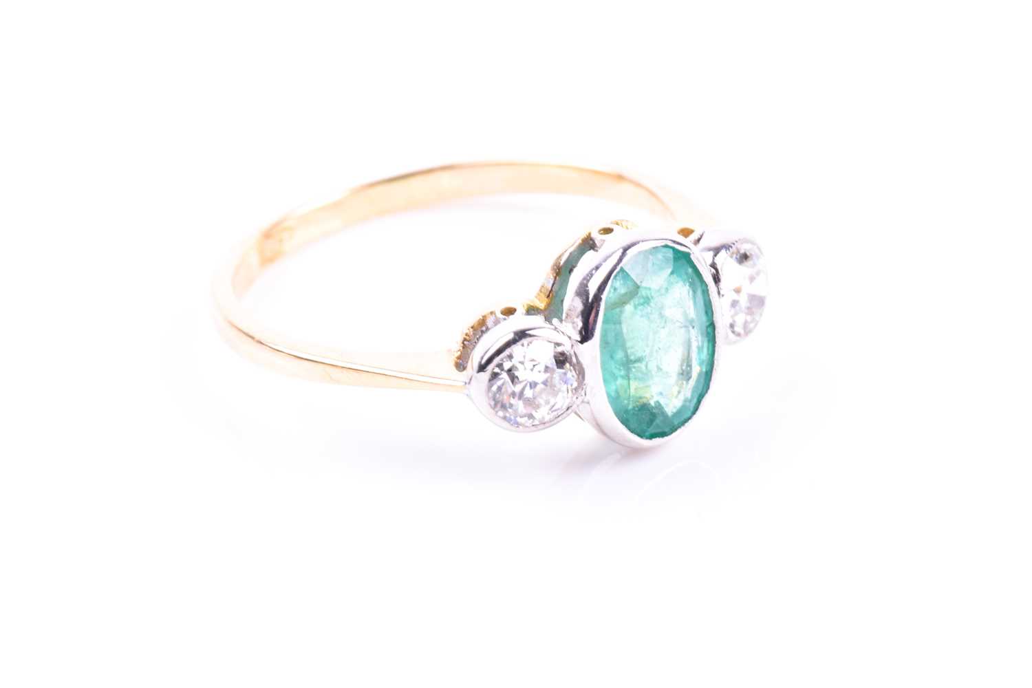 An 18ct yellow gold, diamond, and emerald ring, collet-set with a mixed oval-cut emerald of - Image 5 of 5