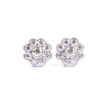 A pair of diamond floral cluster earrings, set with round brilliant-cut diamonds of approximately