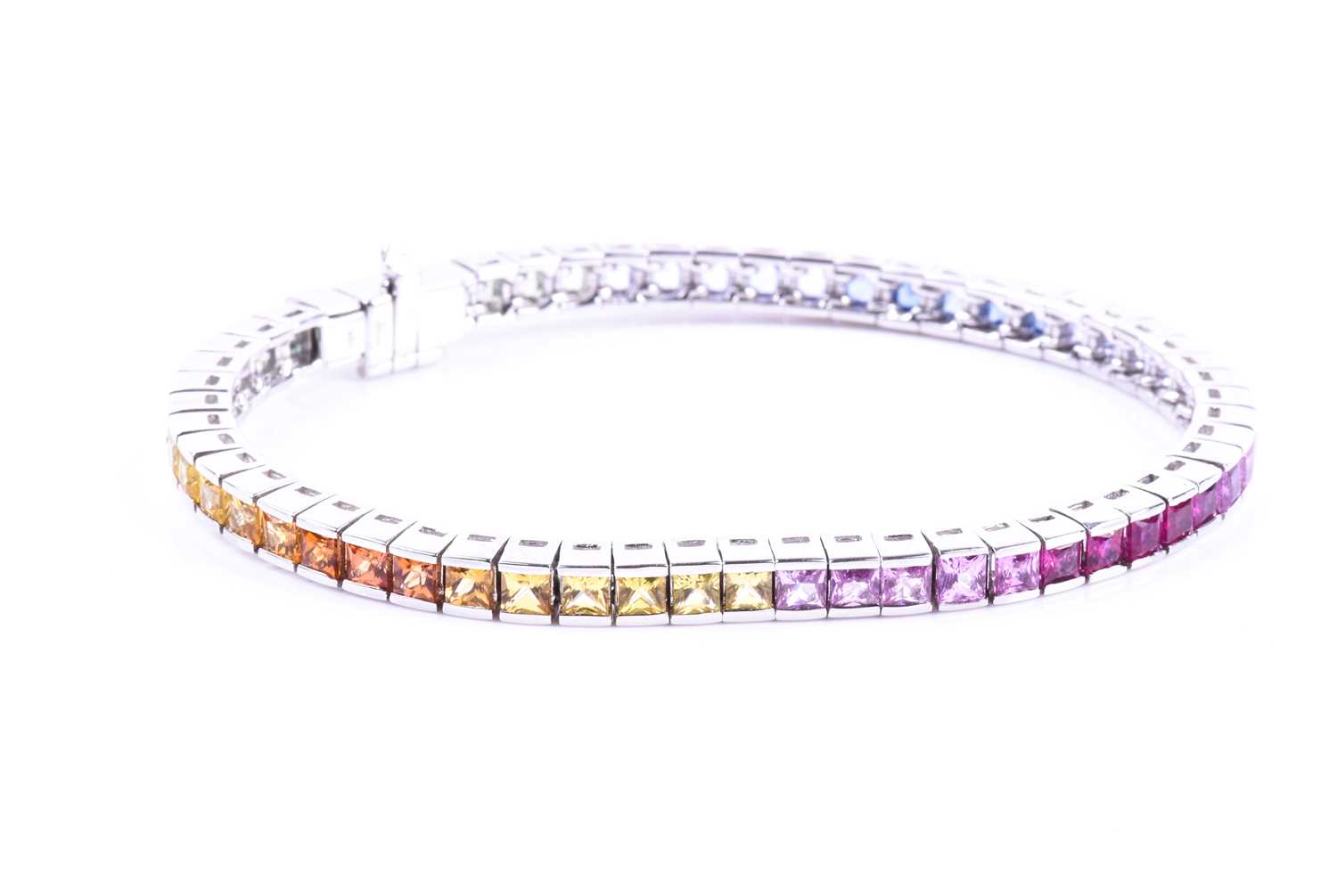 An 18ct white gold and rainbow sapphire bracelet, set with multi-coloured sapphires ranging from