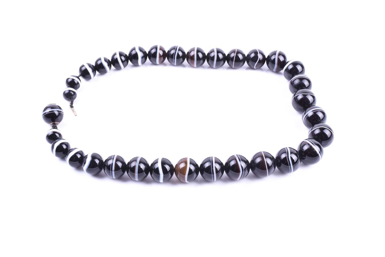 A banded agate necklace, formed of 32 graduated beads, one concealing fitted base metal clasp, the