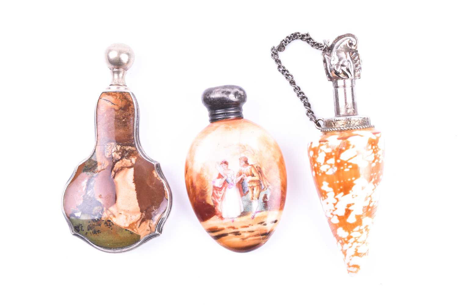 A white metal mounted shell scent bottle 8.4 cm long, together with a white metal and hardstone