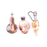 A white metal mounted shell scent bottle 8.4 cm long, together with a white metal and hardstone