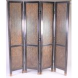 A four fold room divider/screen, with ebonised frame enclosing woven wicker panels, with brass