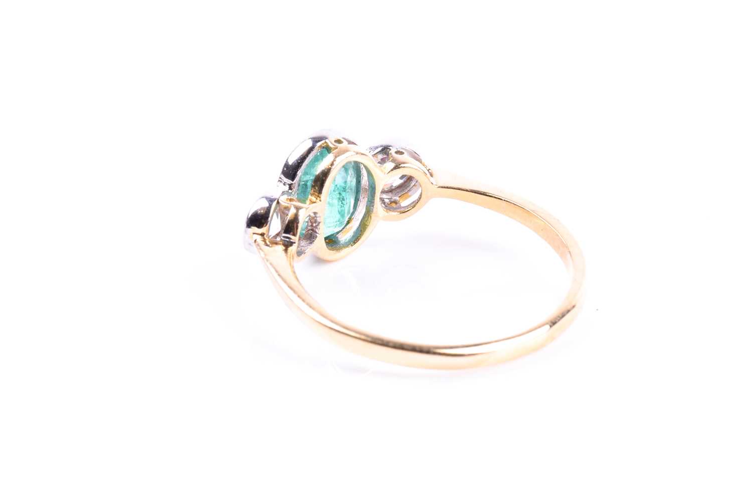 An 18ct yellow gold, diamond, and emerald ring, collet-set with a mixed oval-cut emerald of - Image 3 of 5