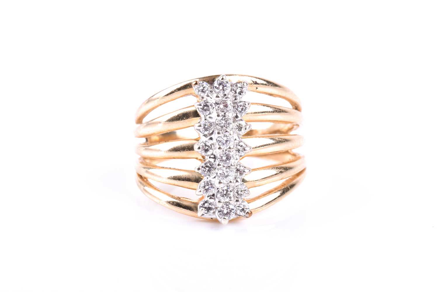 A yellow metal and diamond dress ring, the five-bar split shank centred with a triple row of round