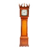 A Geo III oak and mahogany crossbanded longcase clock, the square painted dial for William Evans,