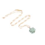 A 9ct yellow gold and emerald pendant, of hexagonal design, set with mixed round-cut stones, pendant