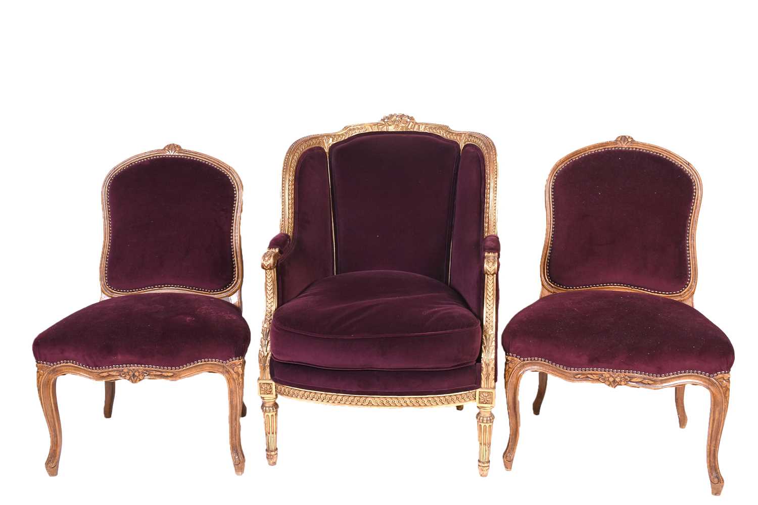 A French carved, gilded and upholstered armchair, late 19th/early 20th century, together with two