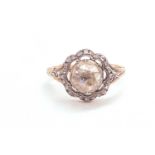 A diamond cluster ring, centred with a rose-cut diamond of approximately 1.04 carats, within a