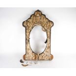 A 19th century Dieppe ivory and bone mounted mirror, with applied carved bone fish and angels on a