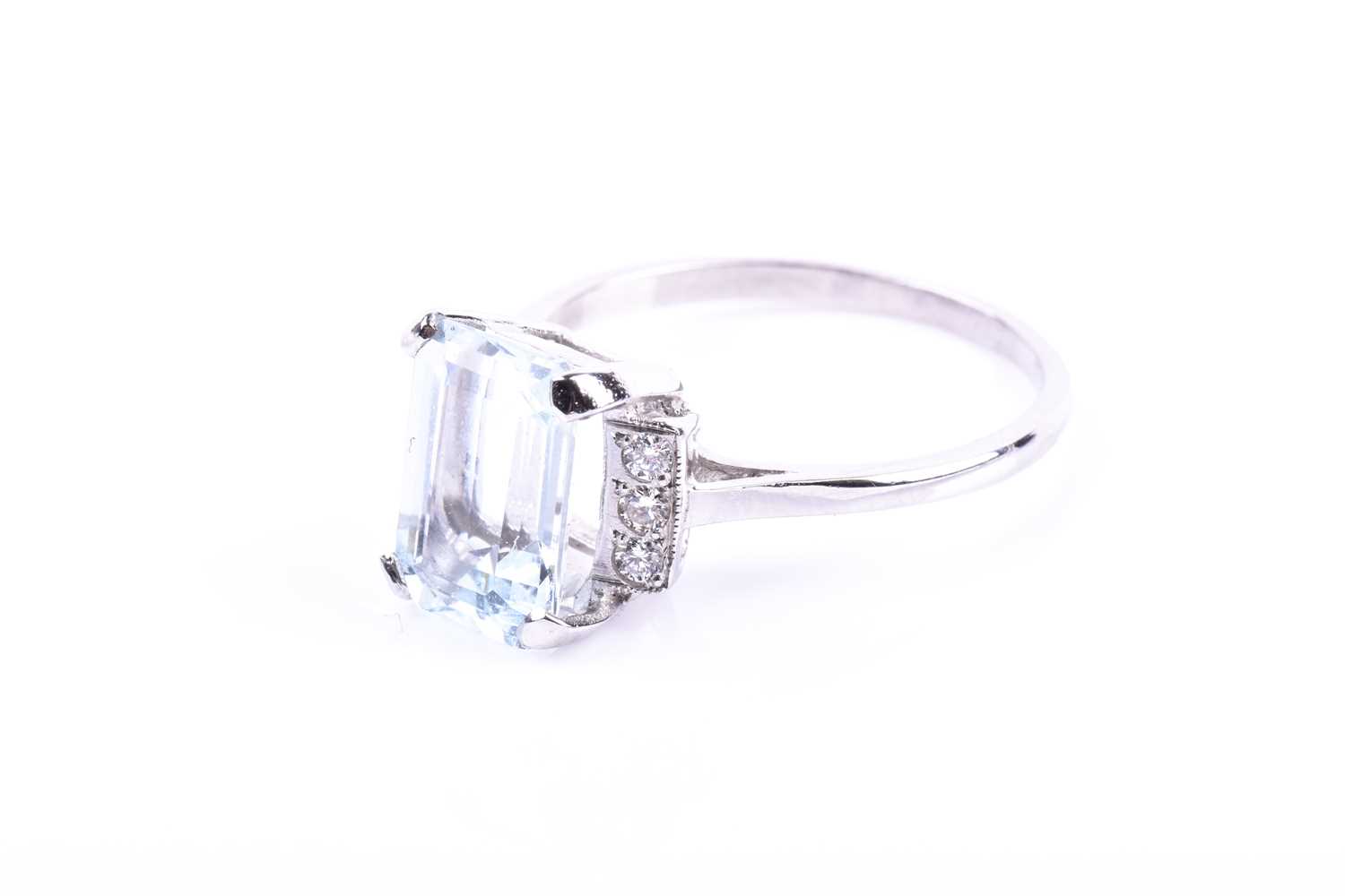 A platinum, diamond, and aquamarine ring, set with an emerald-cut aquamarine of approximately 2.55 - Image 6 of 6