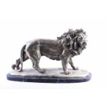 A cast nickel lion, 20th century, modelled standing, on a black marble base, 49cm wide, 30cm high