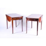 A pair of reproduction mahogany Pembroke tables, the well figured tops with crossbanded and strung