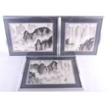 Three Chinese prints of misty mountain and river scapes with wash detail. Bearing red studio marks