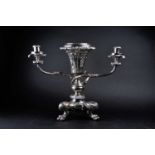 A silver plated centerpiece/epergne, the vase with leafy scroll and shell rim above the pierced body