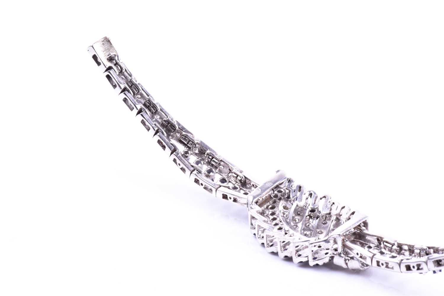 A white metal, diamond, and sapphire bracelet, the swept central segment set with round brilliant- - Image 2 of 5