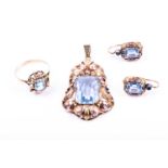 A blue topaz dress suite, the pendant with a rectangular cut-cornered topaz in two colour pierced