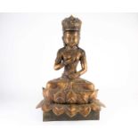 A Chinese bronze figure of Avalokitesvara, 20th century, seated in mudra pose on a double lotus