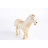 A Chinese Han style white jade horse, Qing, 18th century or later, naturalistically modelled