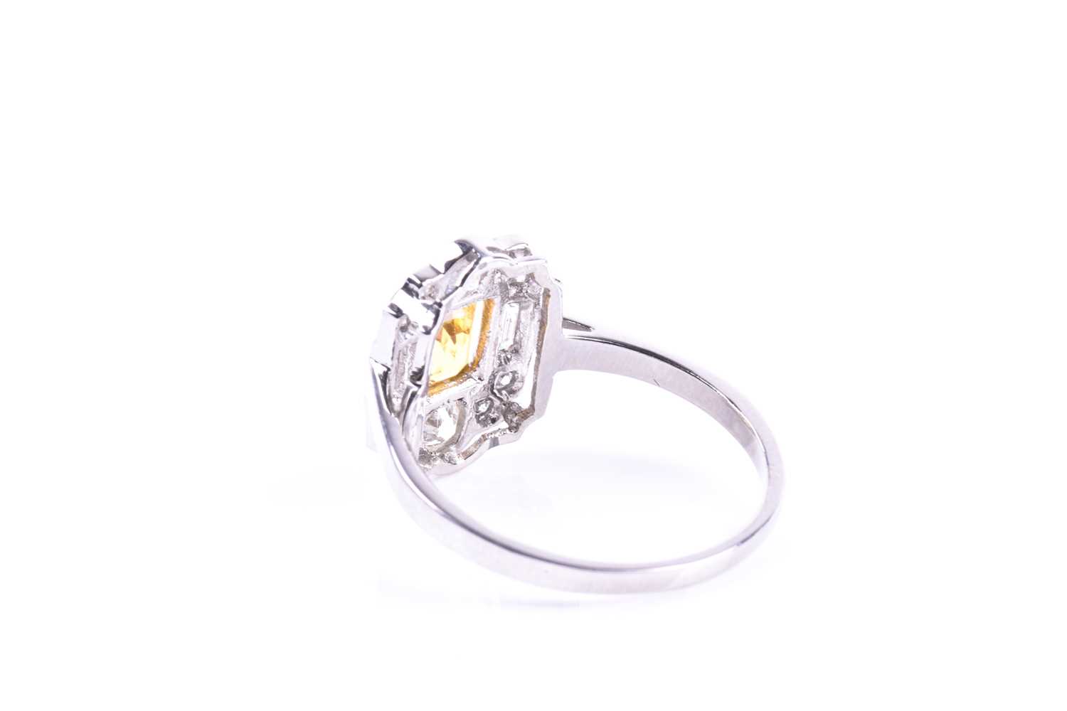 A platinum, diamond, and yellow sapphire ring, in the Art Deco style, set with a mixed-cut - Image 3 of 5