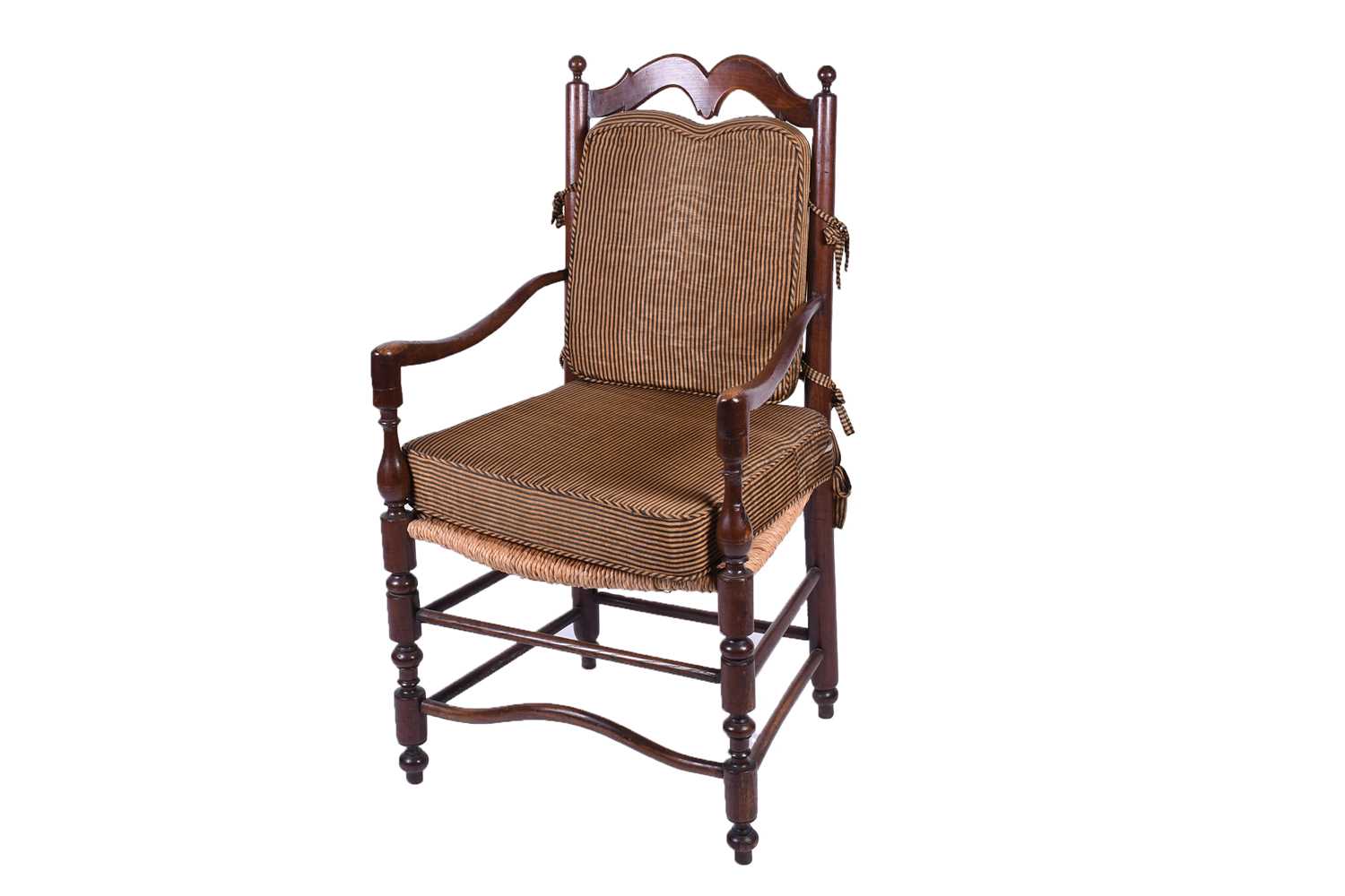 A Spanish walnut ladderback armchair, early 20th century, with ball finials and shaped back