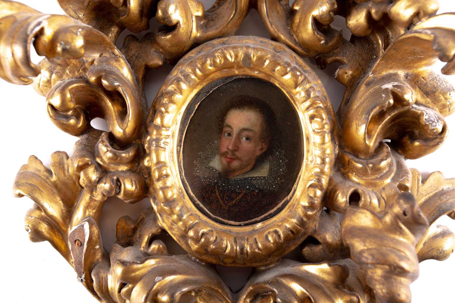 A 17th century oval miniature portrait of a nobleman, painted on wood, in an elaborate scrolling - Image 6 of 6