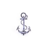 A silver and sapphire anchor brooch, set with mixed round- and oval-cut sapphires, marked 925 to