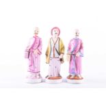 A group of three 19th century porcelain figures, 'People from the East', painted in polychrome