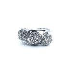 An 18ct white gold and diamond crossover ring, set with three clusters of round brilliant-cut