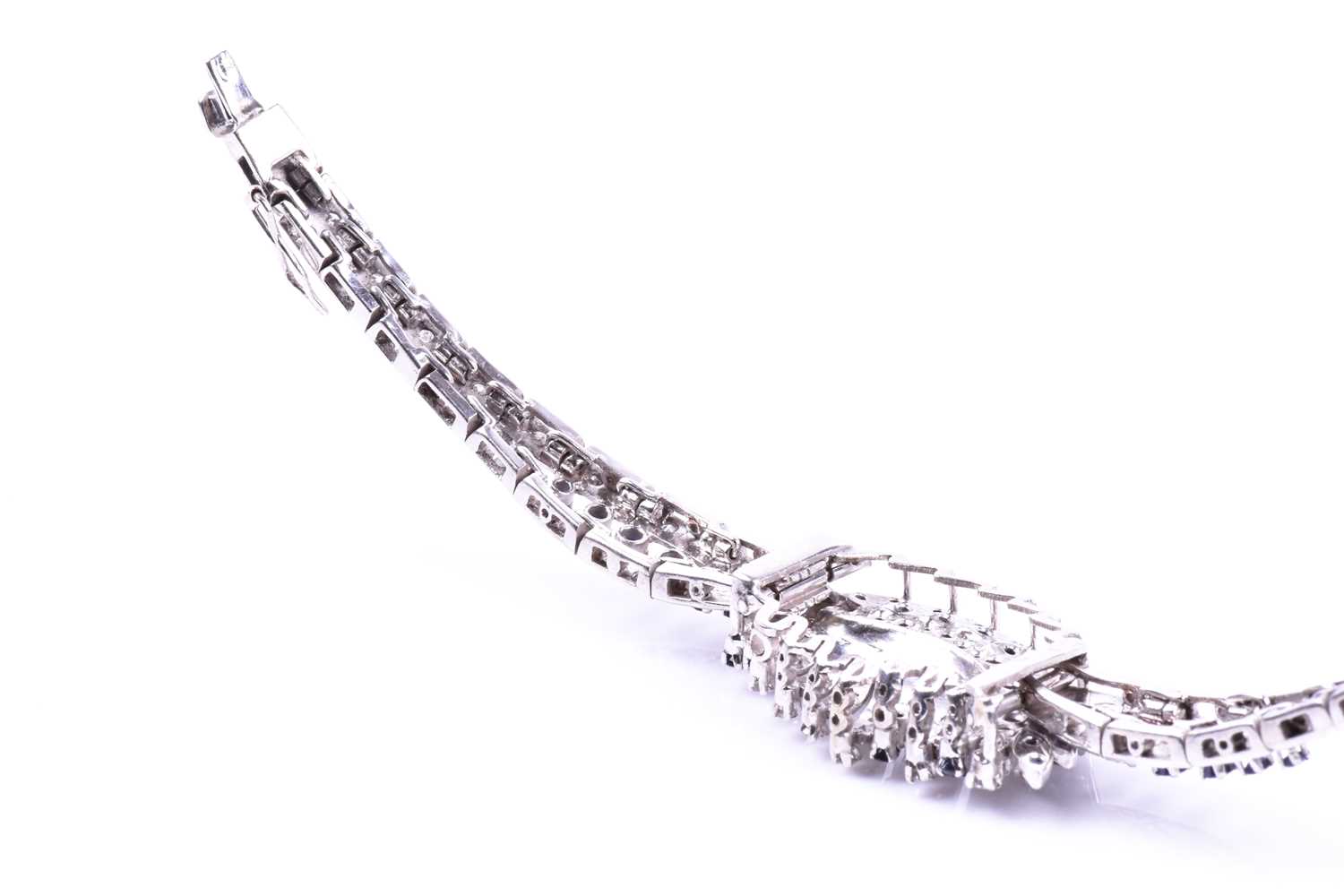 A white metal, diamond, and sapphire bracelet, the swept central segment set with round brilliant- - Image 3 of 5
