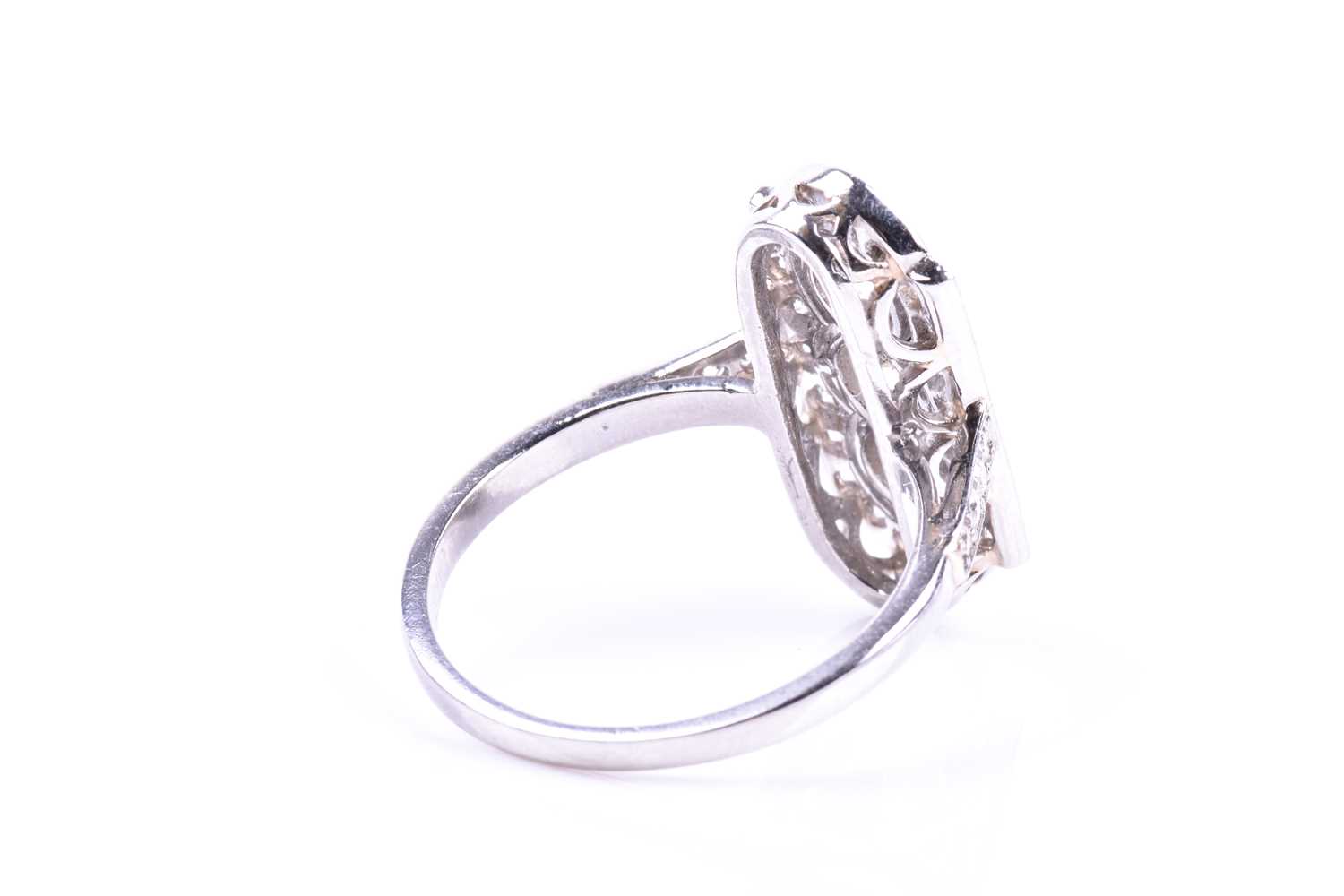 A platinum and diamond ring, in the Art Deco style, the lozenge-shaped plaque ring inset with - Image 2 of 5