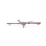 A 9ct yellow gold and diamond pheasant brooch, the body of the pheasant inset with diamond