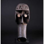 A Dan Kagle/Bugle mask, Liberia/Sierra Leone, the protruding forehead with six relief carved 'Dik-