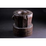 An Oromo carved wood mortar, Ethiopia, a single pierced lug to one side, with linear and diagonal
